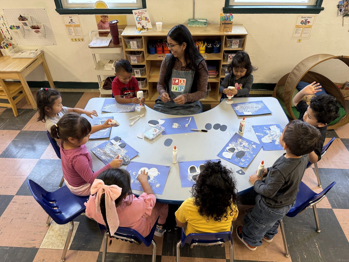 Preschool activity photo showing children learning and playing, image 1 of 6