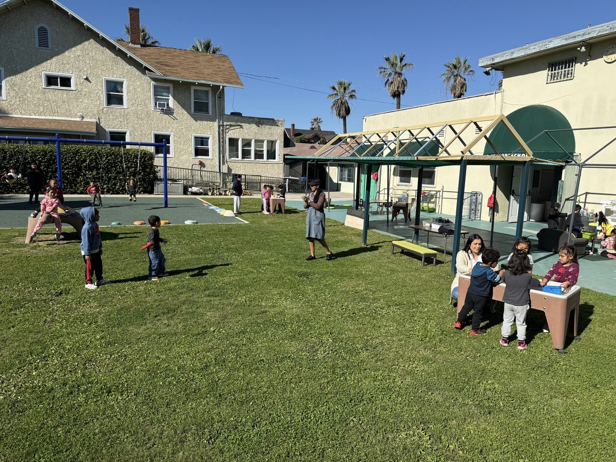 Preschool activity photo showing children learning and playing, image 4 of 6