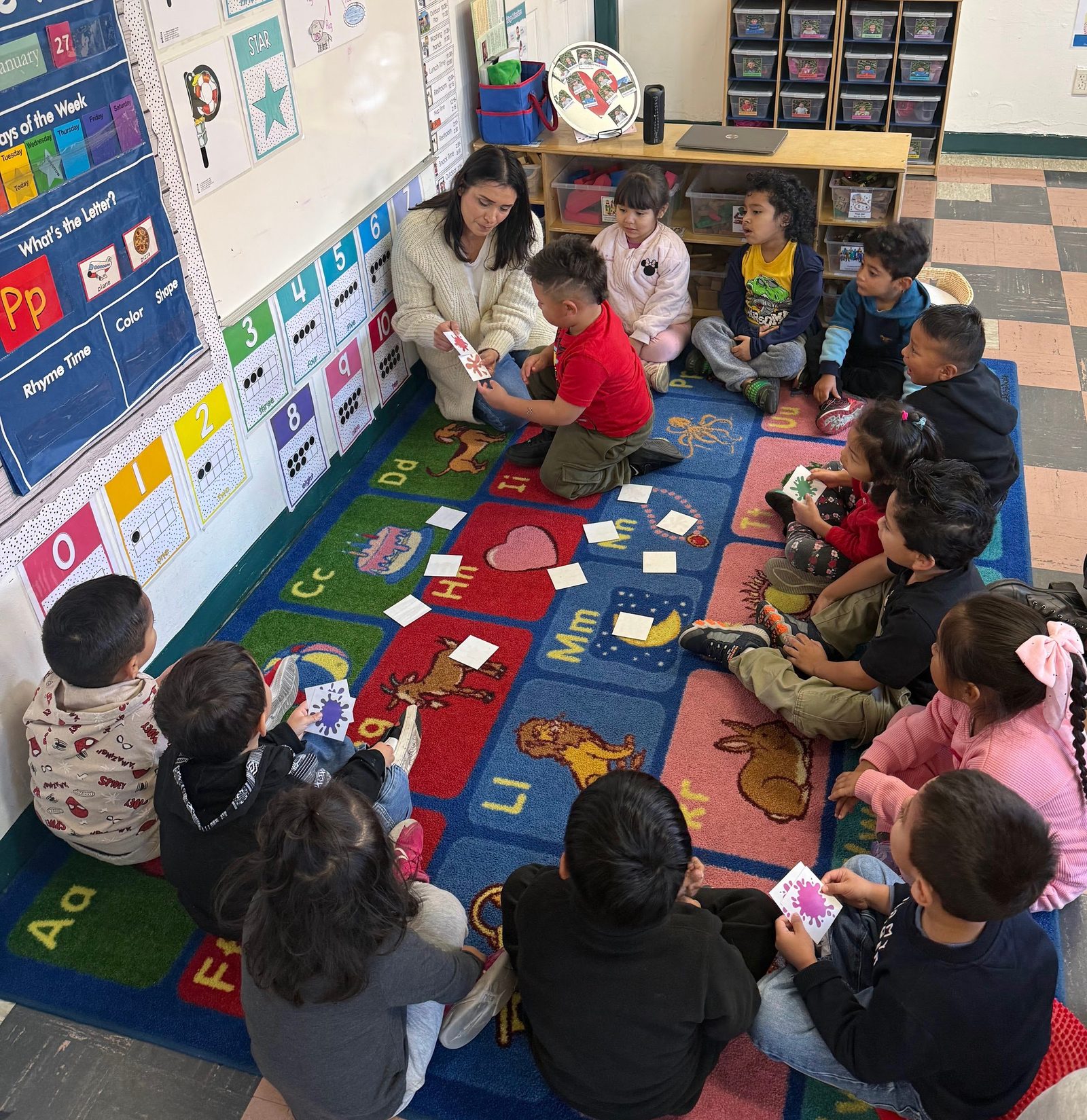 Happy preschool child engaged in learning activities at desk